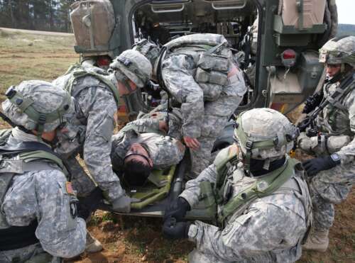 Saber Junction 15 U.S. Soldiers assigned to Bravo Troop, 1st Squadron, 2nd Cavalry Division prepare to medically evacuate a simulated wounded Soldier while conducting a movement to contact drill during exercise Saber Junction 15 at the U.S. Army’s Joint Multinational Readiness Center in Hohenfels, Germany, April 12, 2015. Saber Junction 15 prepares NATO and partner nation forces for offensive, defensive and stability operations and promotes interoperability among participants. Saber Junction 15 has more than 4,700 participants from 17 countries, to include: Albania, Armenia, Belgium, Bosnia, Bulgaria, Great Britain, Hungary, Latvia, Lithuania, Luxembourg, Macedonia, Moldova, Poland, Romania, Sweden, Turkey and the U.S. (U.S. Army photo by Spc. Brian Chaney/Released)